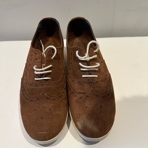 Brown suede shoes, gently worn.